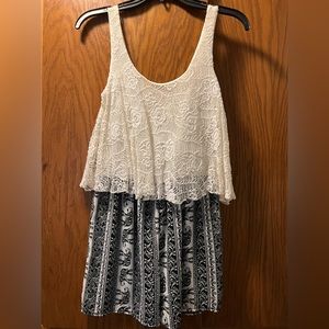 White lace (on top) Romper with silky black/white bottom. Polyester material